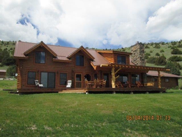 A timber home surrounded by Montana landscape